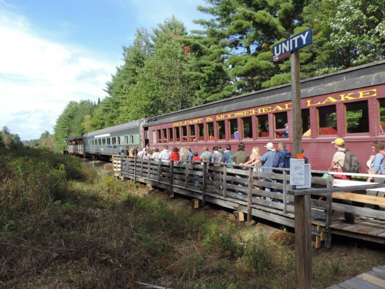 belfastandmooseheadlakerail_santa-express-train-passengers-boarding-wooden-platform Belfastandmooseheadlakerail Santa Express Train Passengers Boarding Wooden Platform