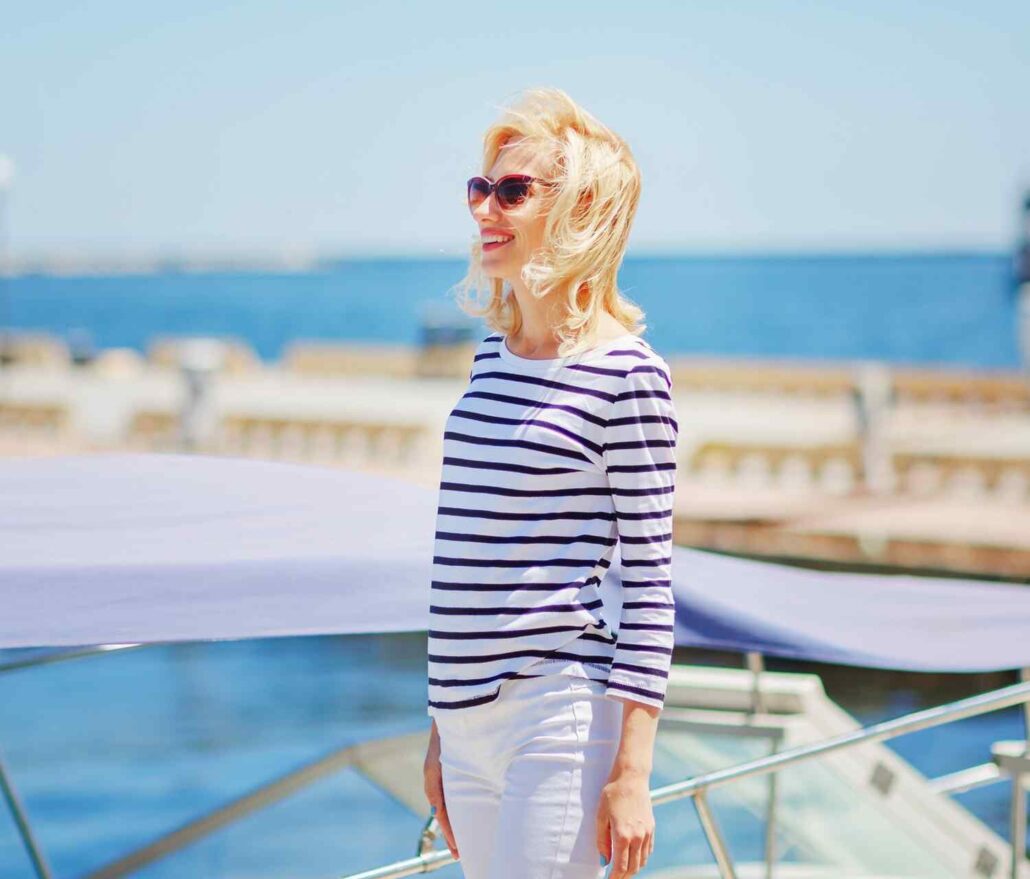 belfastandmooseheadlakerail_santa-express-woman-striped-shirt-sunglasses-waterfront Belfastandmooseheadlakerail Santa Express Woman Striped Shirt Sunglasses Waterfront