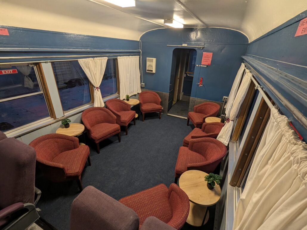 cooperstownandcharlottevalleyrailroad_santa-claus-express-lounge-seats-train-lounge-red-chairs Cooperstownandcharlottevalleyrailroad Santa Claus Express Lounge Seats Train Lounge Red Chairs