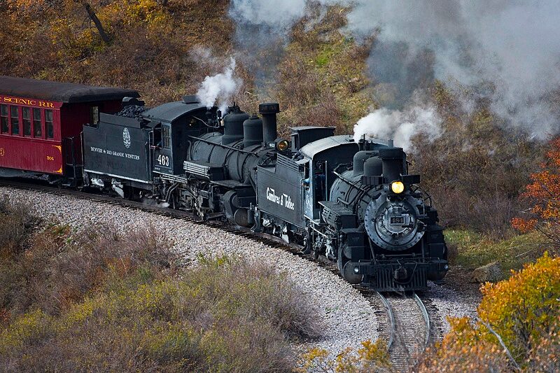 cumbrestoltec_all-aboard-chama-train-then-bus-coach-steam-train-curving-autumn-landscape Cumbrestoltec All Aboard Chama Train Then Bus Coach Steam Train Curving Autumn Landscape