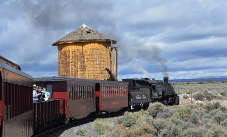 cumbrestoltec_all-aboard-chama-train-then-bus-coach-steam-train-yellow-water-tower Cumbrestoltec All Aboard Chama Train Then Bus Coach Steam Train Yellow Water Tower