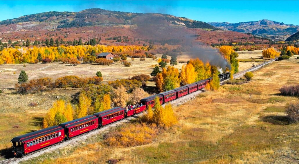 cumbrestoltec_all-aboard-chama-train-then-bus-coach-train-autumn-landscape-yellow-orange Cumbrestoltec All Aboard Chama Train Then Bus Coach Train Autumn Landscape Yellow Orange