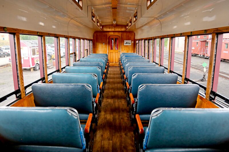 cumbrestoltec_all-aboard-chama-train-then-bus-coach-train-car-seating-wooden-interior Cumbrestoltec All Aboard Chama Train Then Bus Coach Train Car Seating Wooden Interior