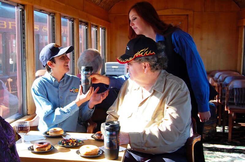 cumbrestoltec_all-aboard-chama-train-then-bus-coach-train-passengers-coffee-donuts Cumbrestoltec All Aboard Chama Train Then Bus Coach Train Passengers Coffee Donuts