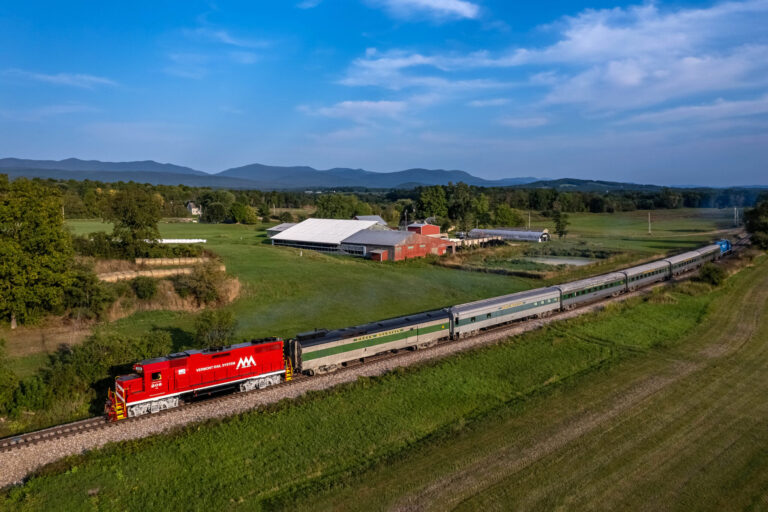rails-vt_champlain-valley-dinner-train-dinner-train-red-locomotive-green-cars Rails Vt Champlain Valley Dinner Train Dinner Train Red Locomotive Green Cars