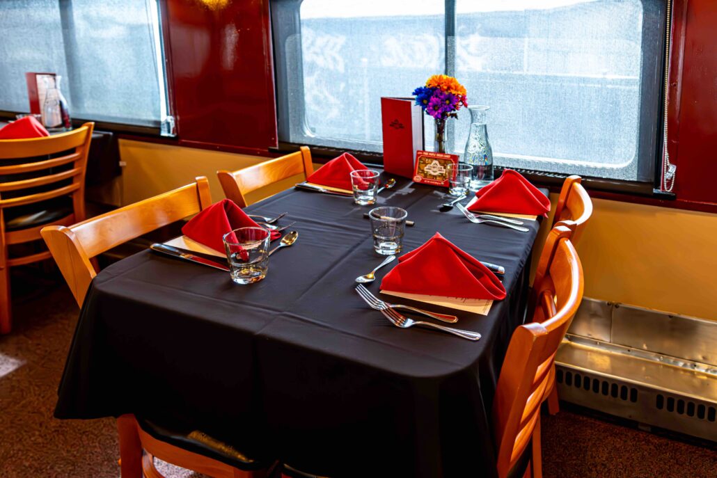 rails-vt_champlain-valley-dinner-train-dinner-train-table-red-napkins Rails Vt Champlain Valley Dinner Train Dinner Train Table Red Napkins